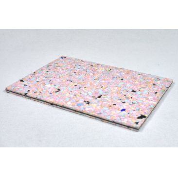 Close-up of a 16mm Underfloor Soundproof Underlay Chip Foam Sheet with a speckled foam layer and a black damping barrier, placed on a wooden surface.