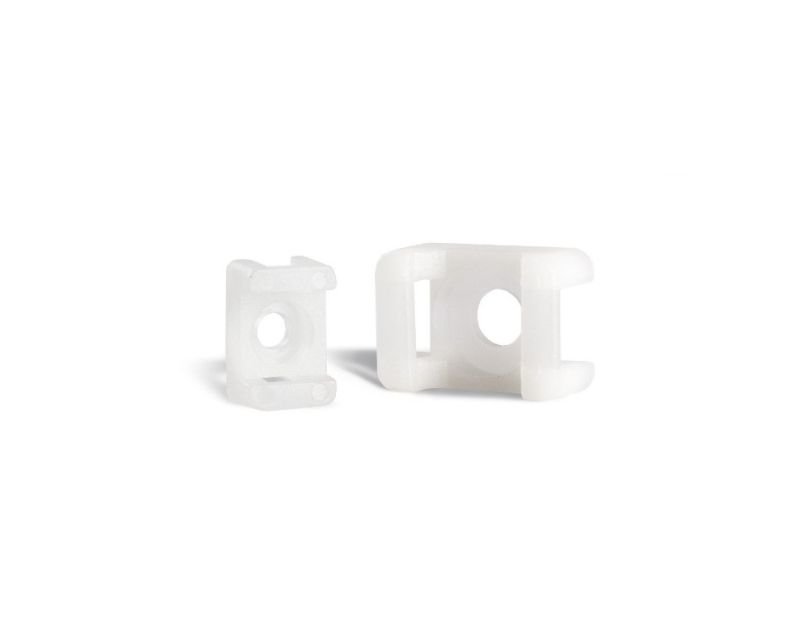 Two Partex SM3-NAT Saddle Mounts in natural colour, made of Nylon 6.6, shown from different angles against a white background. Each mount features a central hole for an M5 screw and a slot for securing cable ties up to 9mm wide. Two Partex SM3-NAT Saddle Mounts in natural colour, made of Nylon 6.6, shown from different angles against a white background. Each mount features a central hole for an M5 screw and a slot for securing cable ties up to 9mm wide.